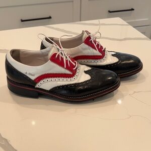 LEONARDO Handmade women's golf shoes in black/white/red full-grain leather.